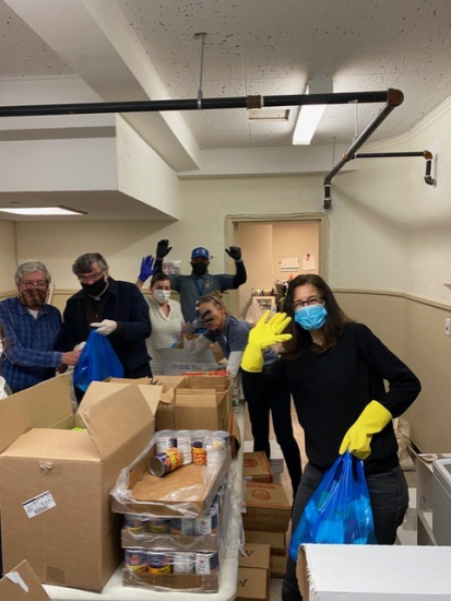 St. Charles parishoners and priests volunteer at Catholic Charities